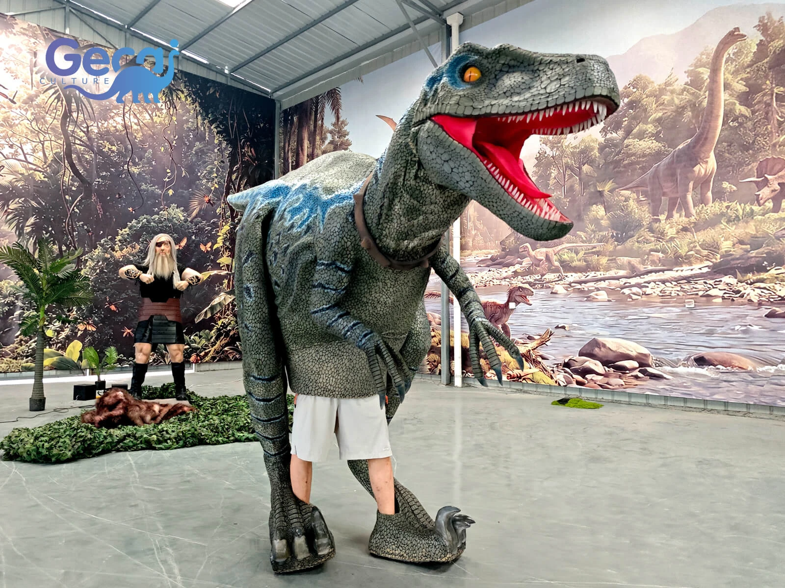 Realistic visible legs raptor dino costume with flexible movement and lifelike details. Custom dinosaur costumes for theme parks, shows and events.