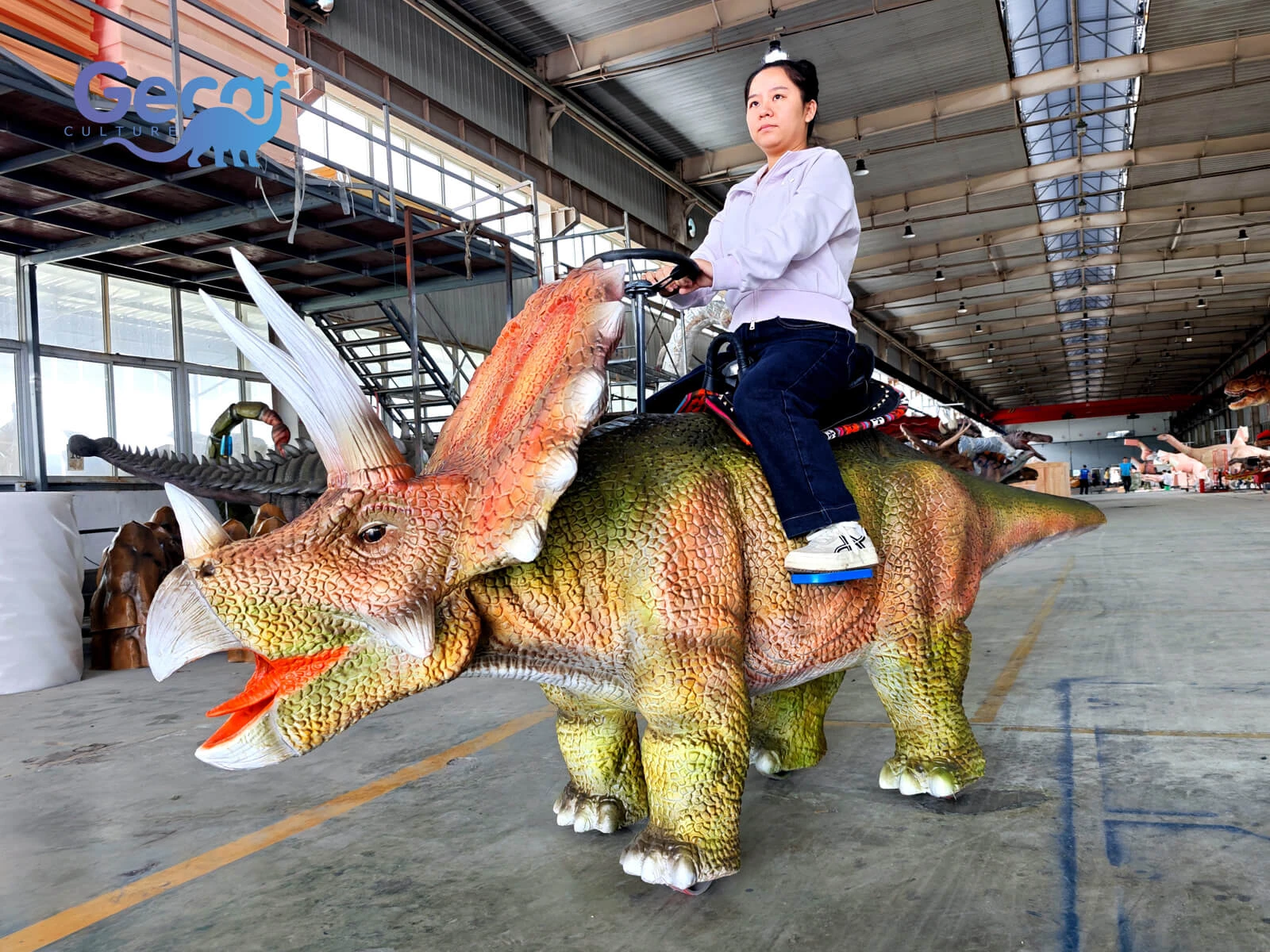 Walking electric Triceratops dinosaur ride with realistic design and motorized movement. Custom riding dinosaurs for theme parks and family attractions.
